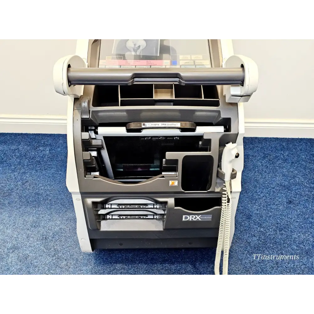 Carestream DRX-Revolution DRXR-1 top-down view of open detector bay showing RC Imaging DRW Grid Pro and detector slot