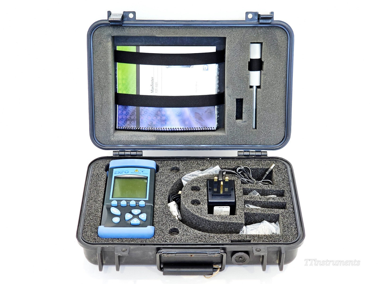 EXFO FOT-922 MaxTester kit open in hard carry case showing unit, AC adapter, VFL, manuals and accessories