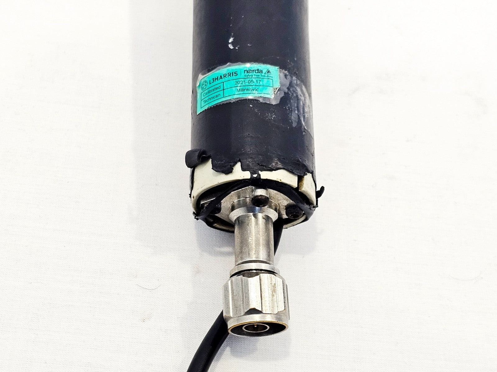 Narda 3501/03 probe handle base showing L3Harris Narda calibration label dated 2021-05-17 and Lemo output connector