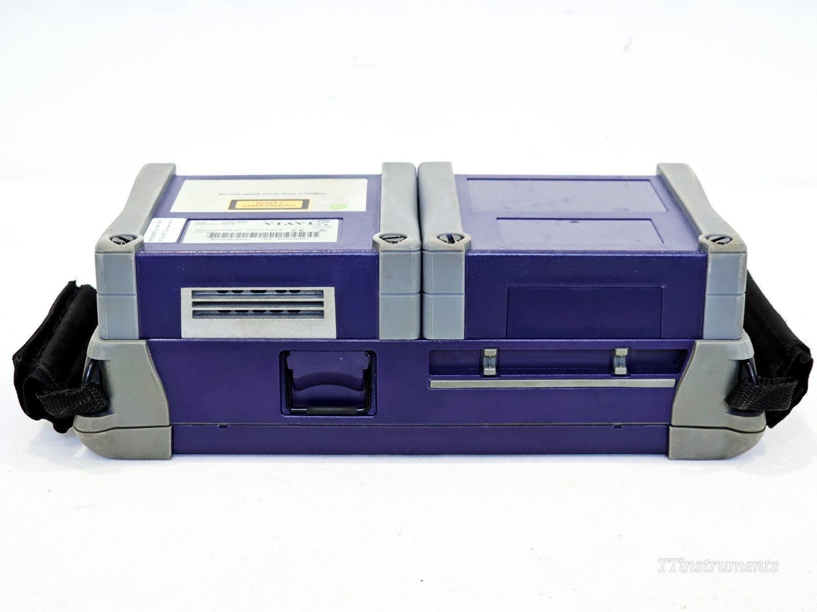 VIAVI MTS 4000 V2 bottom view showing battery compartment latch, module bay screws and Class 1 laser label