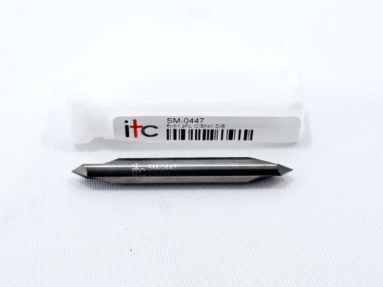ITC SM-0447 6mm solid carbide double-ended countersink removed from tube, showing cutting geometry and ITC branding