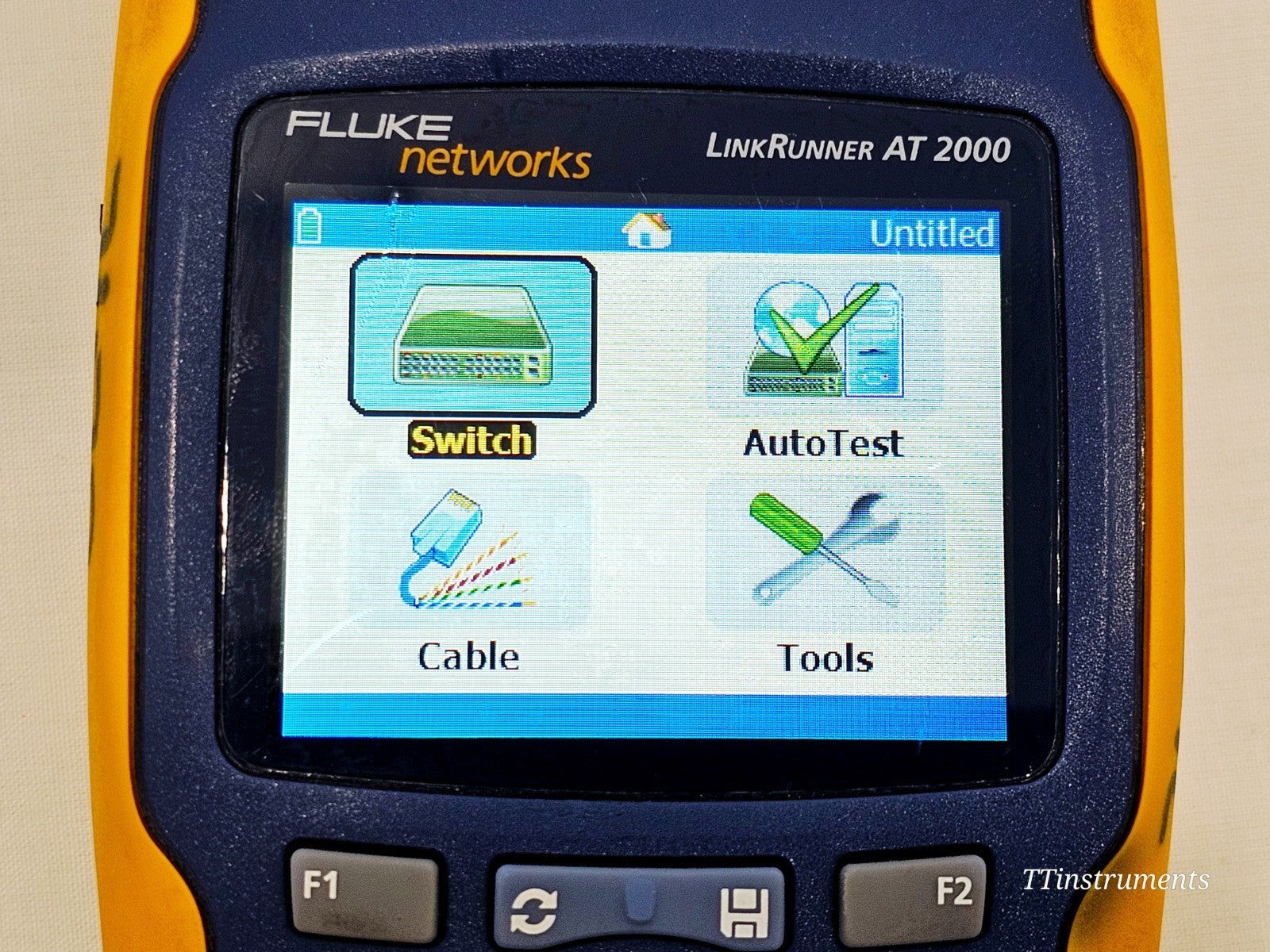 Fluke Networks used cable tester showing cosmetic condition and label