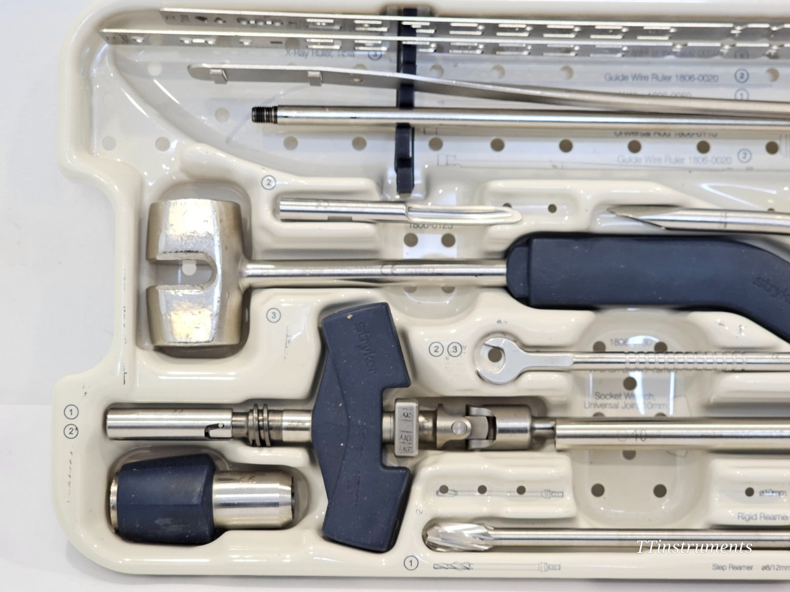 Stryker 1806-9051 tray left-side close-up showing Slap Hammer, Guide Wire Pusher with chuck, Socket Wrench and Reduction Spoon
