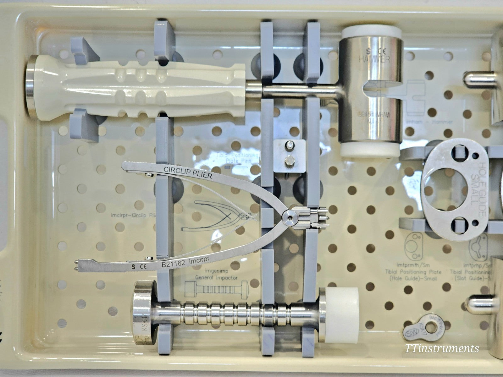 Stanmore Implants METS Knee Instruments Tray — used condition, side view of tray and instrument handles