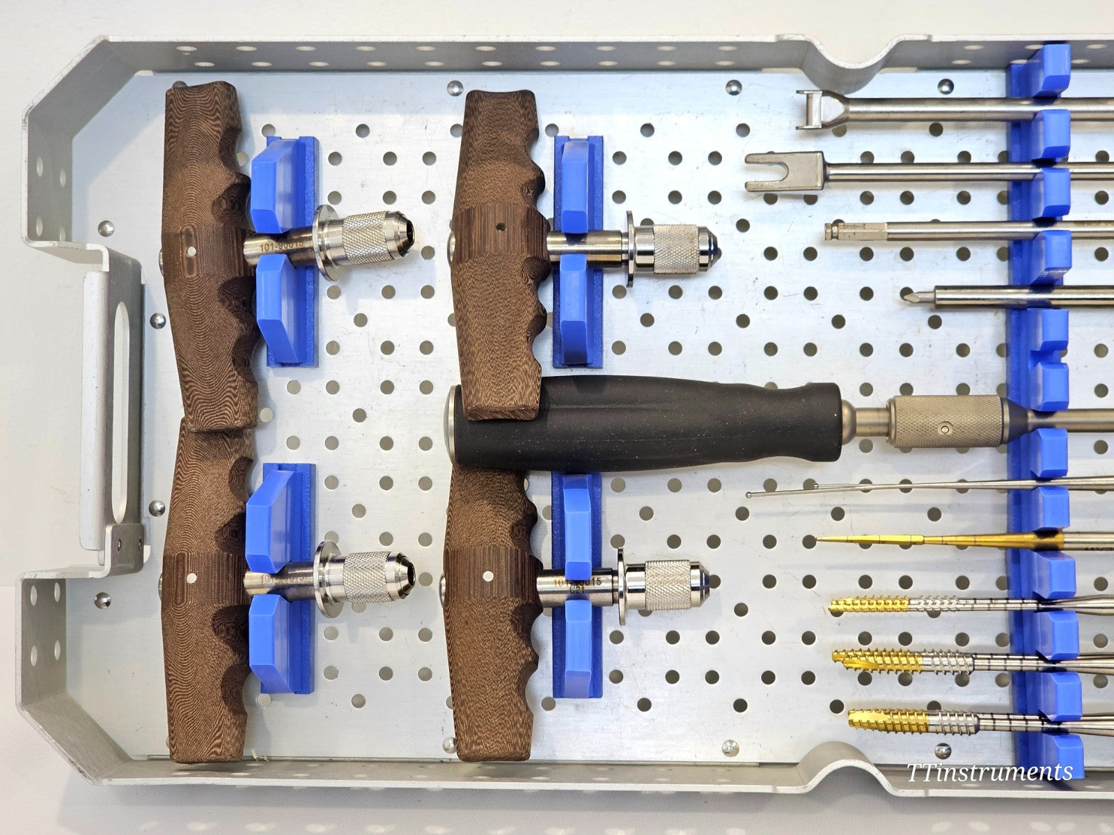 Stryker K2M Core Tray 1381 — close-up of left side showing four universal handles with part number 101-90015 labels and foam organisers