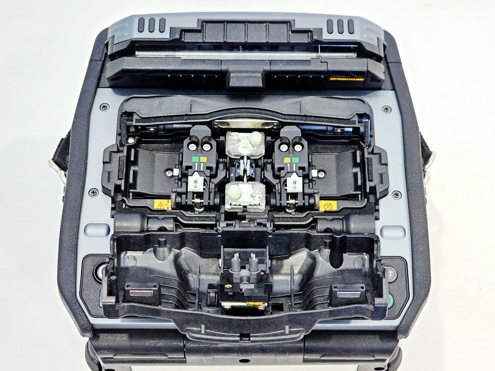 Fujikura 90S fusion splicer lid open showing fibre alignment and splicing chamber