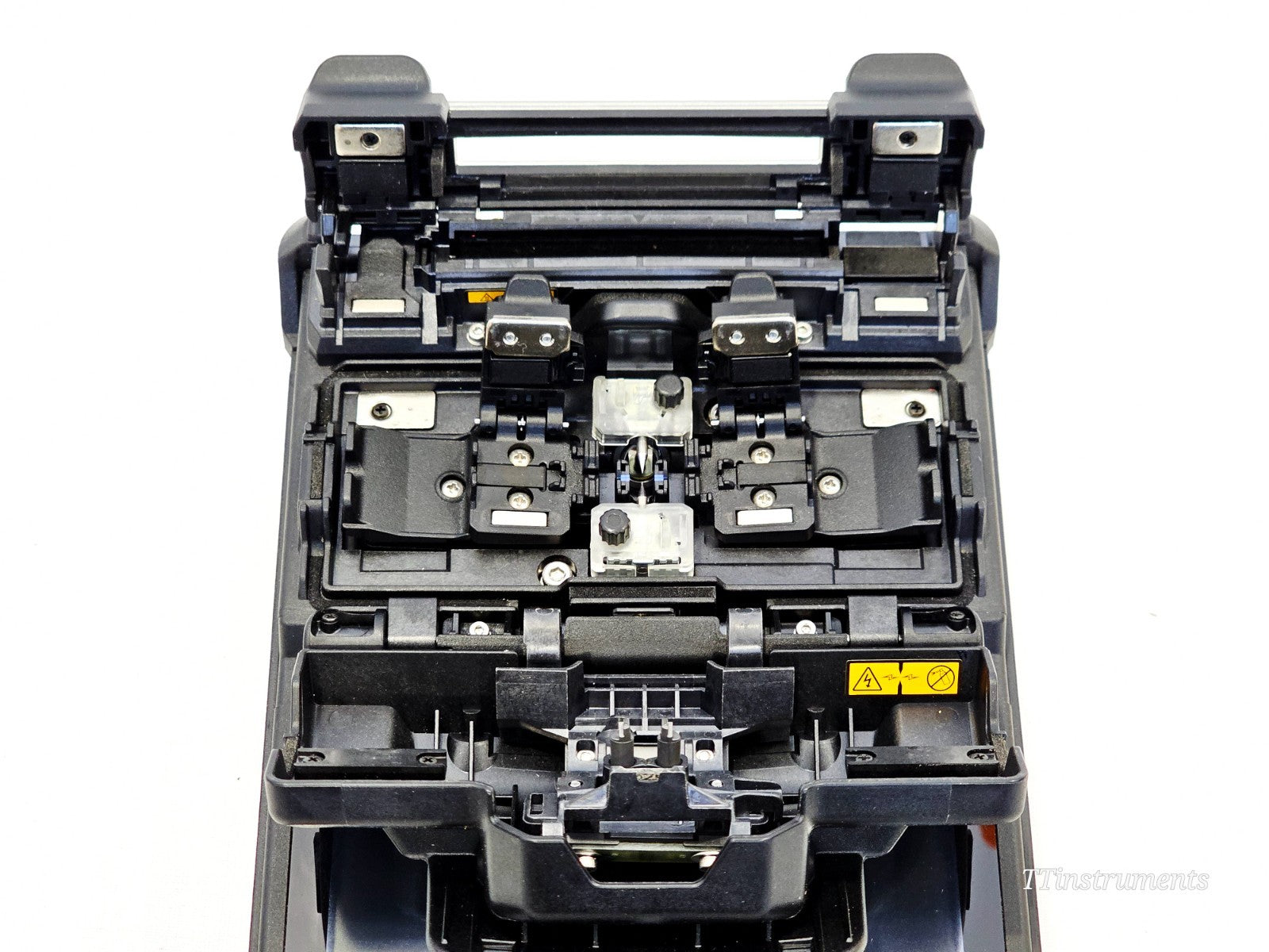 Fujikura 41S fusion splicer interior top-down view showing V-groove alignment stage, fibre holders and electrode area
