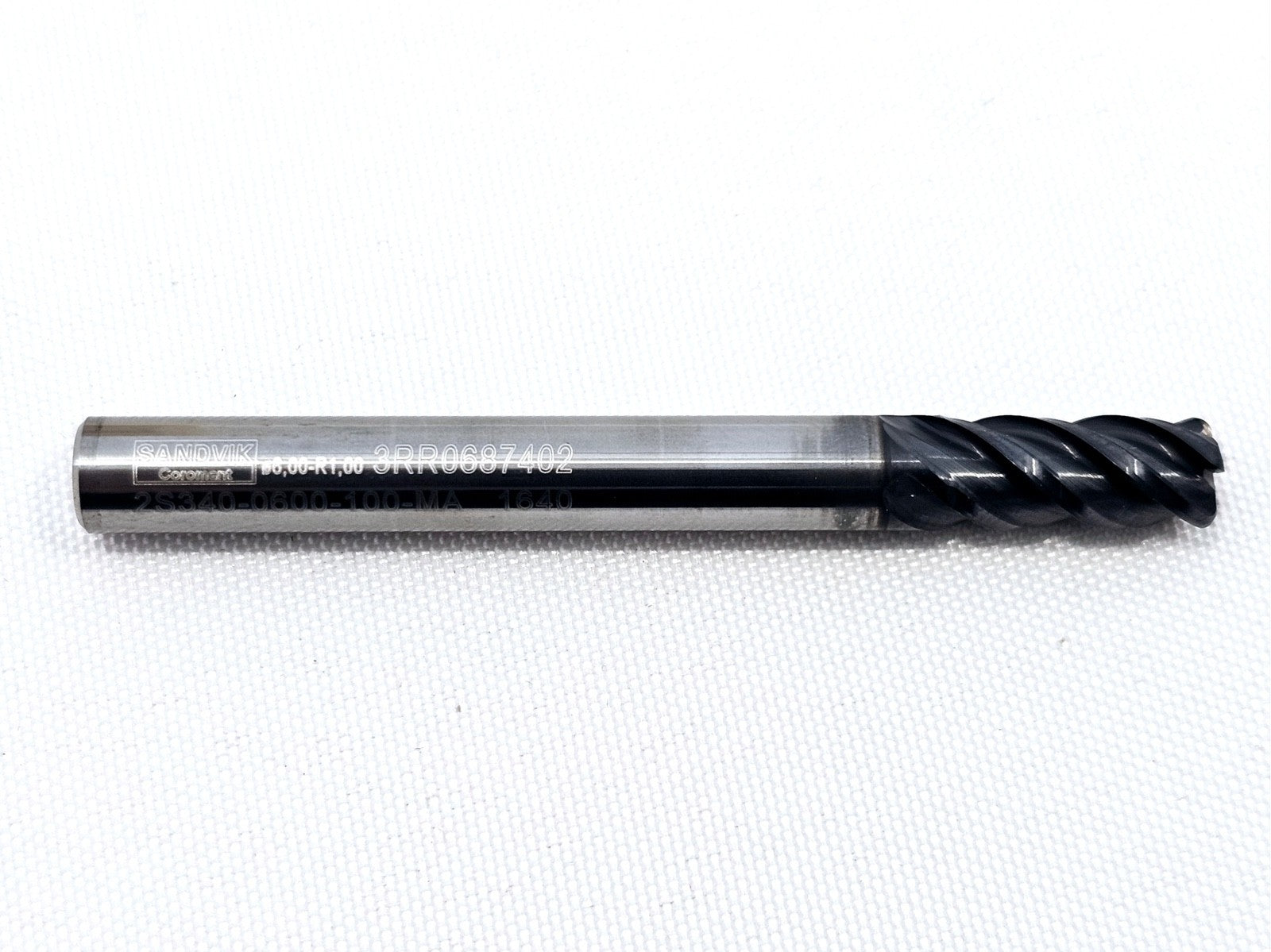 Sandvik Coromant CoroMill Plura 2S340-0600-100-MA 1640 6mm solid carbide end mill side profile showing TiAlN coating and shank markings