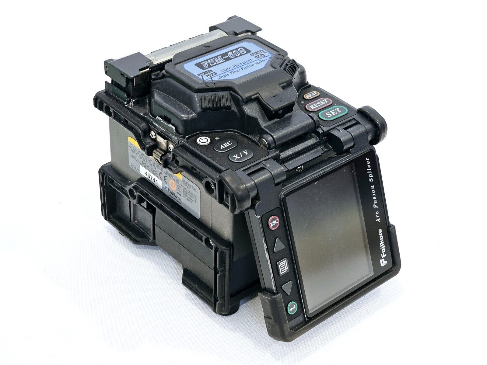 Fujikura FSM-60S splicing chamber close-up showing V-groove fibre alignment mechanism
