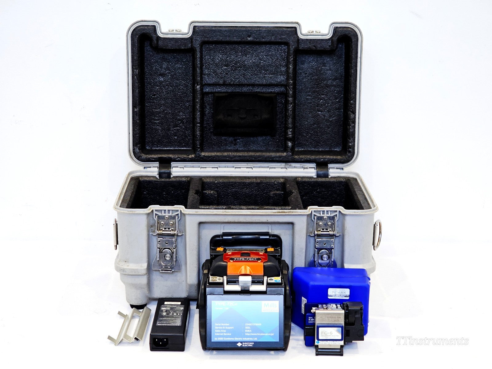 Sumitomo TYPE-72C+ splicer displaying firmware version screen on touchscreen, with full kit and carry case