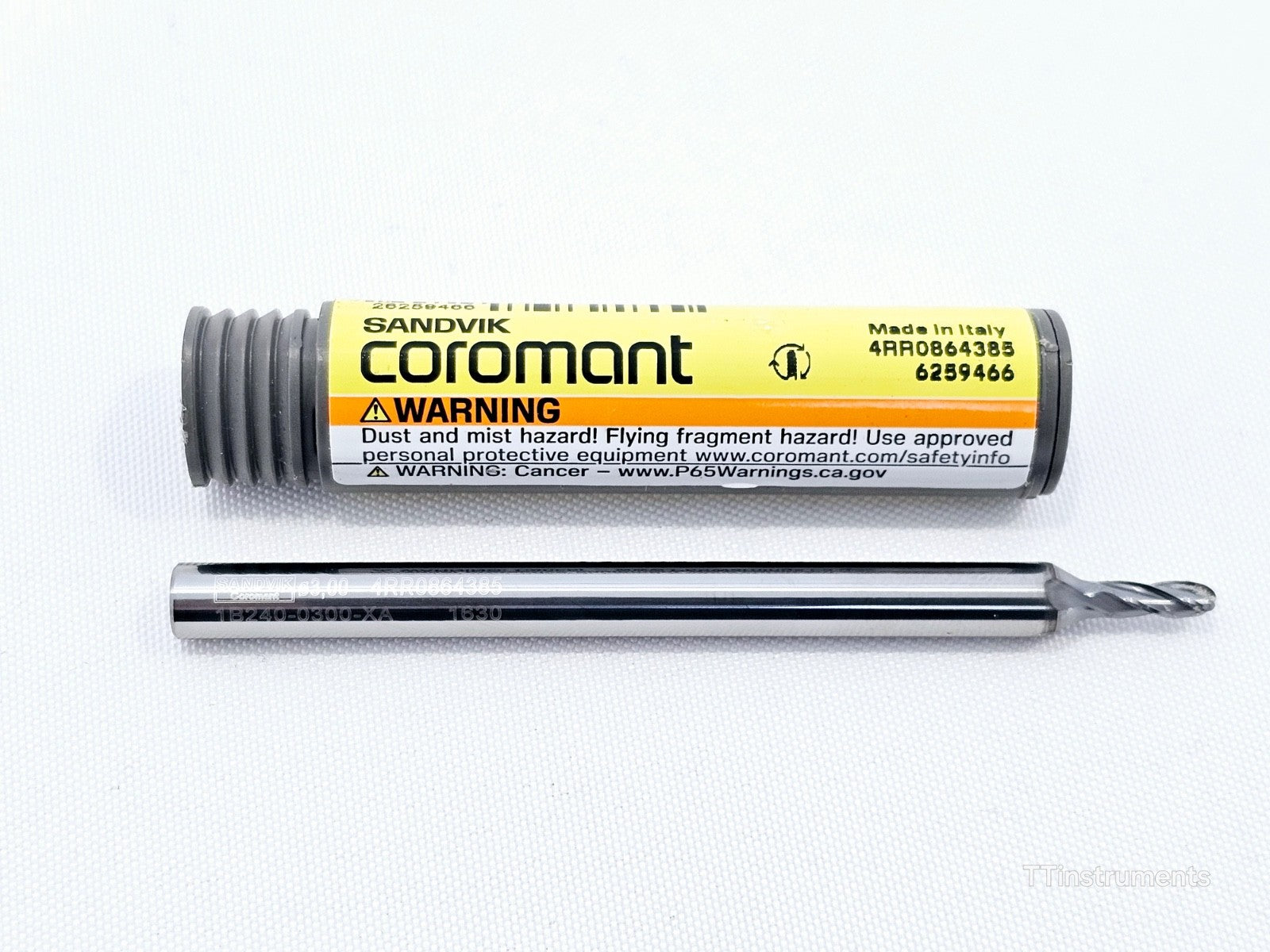 Sandvik Coromant 1B240-0300-XA 1630 CoroMill Dura 3mm carbide ball nose end mill beside storage tube