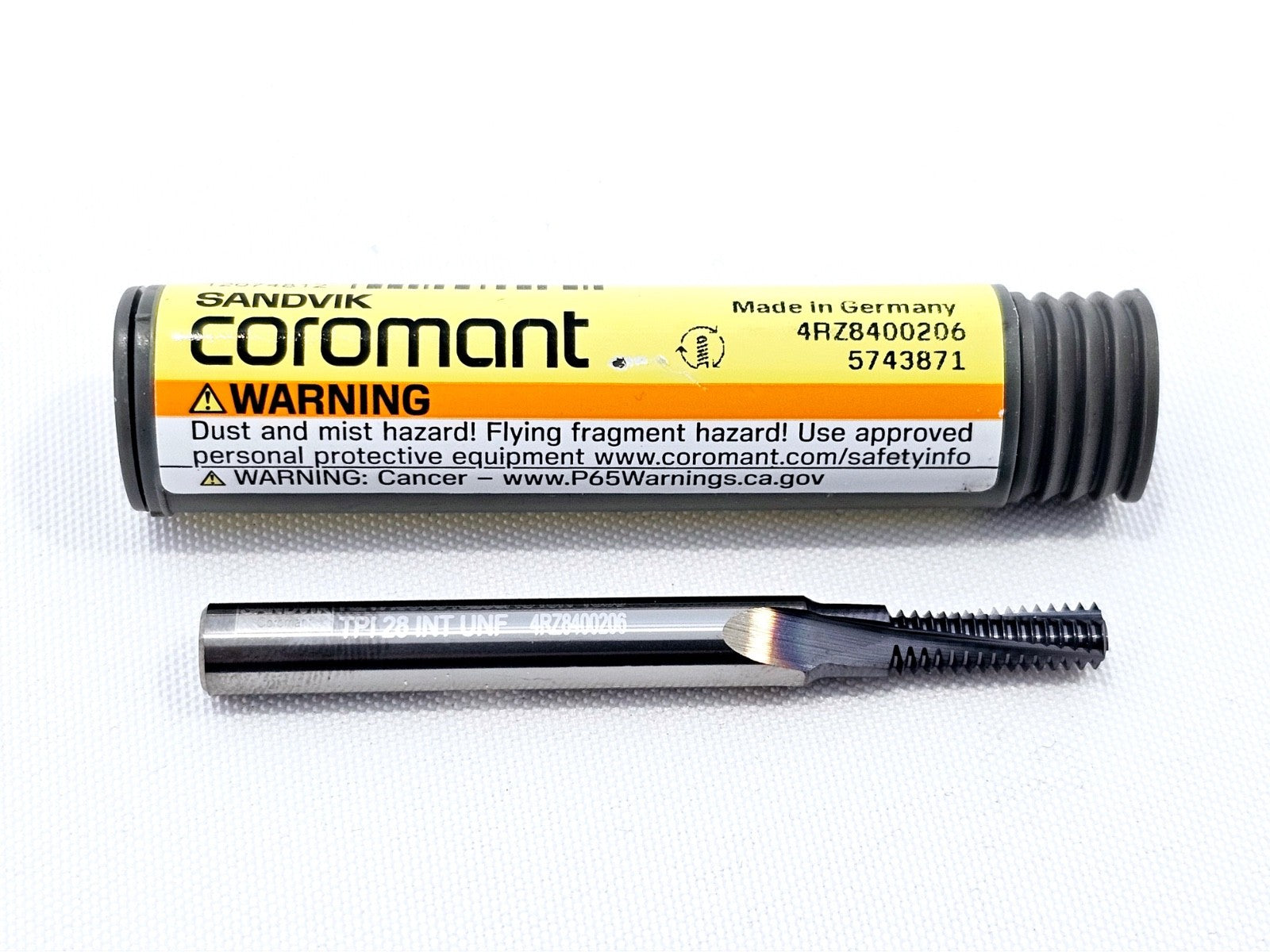 Sandvik Coromant R217.33C048280AC13N 1630 solid carbide thread mill removed from tube, showing cutting flutes