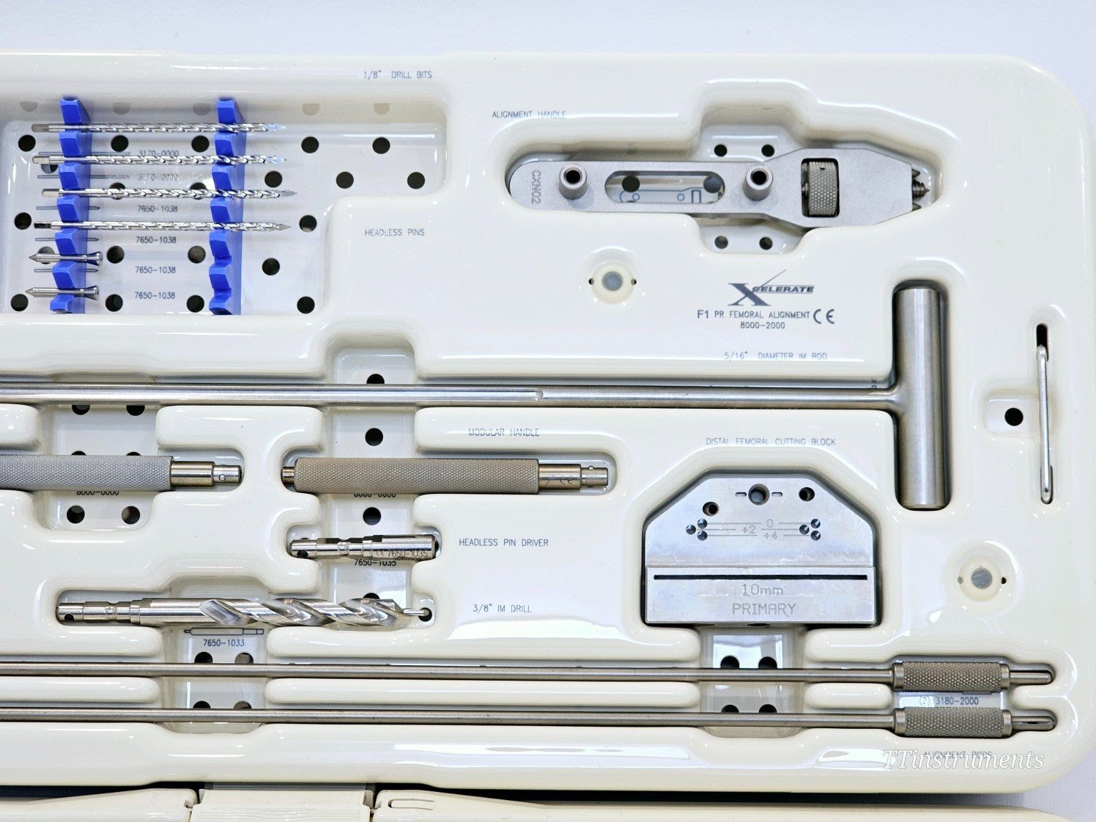 Stryker 8000-2000 XCELARATE Scorpio PR instrument tray showing 10 mm PRIMARY distal femoral cutting block, alignment handle, headless pin driver and IM drills