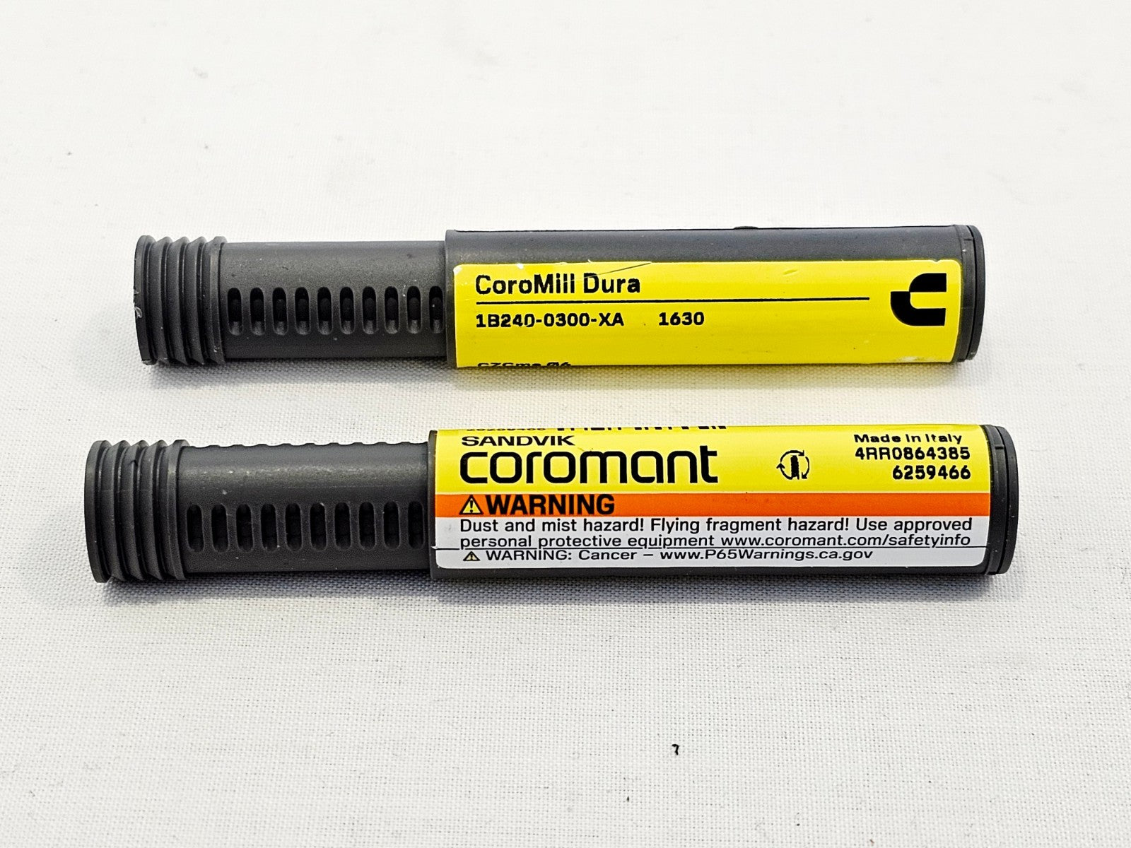 Two Sandvik Coromant 1B240-0300-XA 1630 CoroMill Dura ball nose end mills in protective tubes, top view