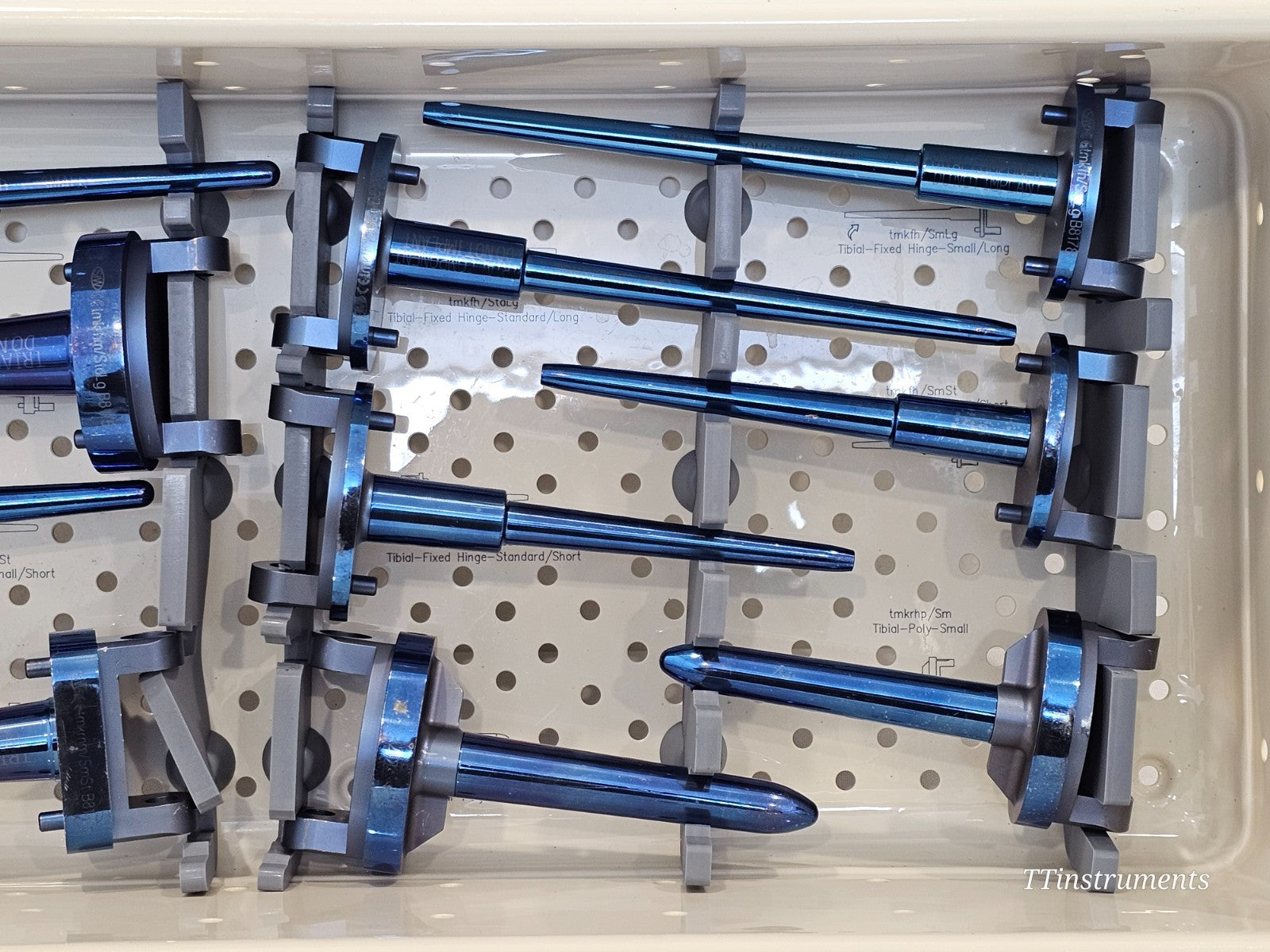 Stanmore METS SMILES Knee Trial Set upper tray close-up showing tibial fixed hinge Small/Long and Standard/Short and Long trial stems with engraved labels