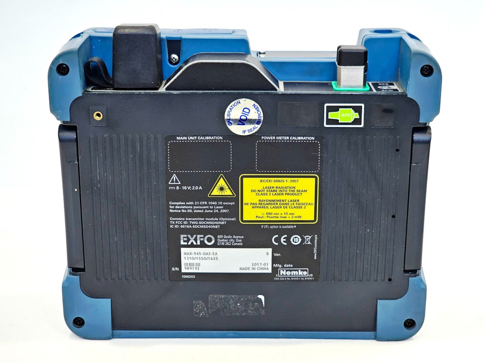 EXFO MAX-945-SM3 rear panel showing label: model MAX-945-SM3-EA, S/N 989192, MFD 2017-01, calibration void sticker