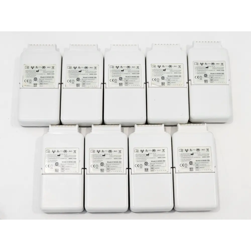Rear view of 9x Philips IntelliVue MX40-2B4 units showing model label MX40-2B4, serial numbers and regulatory marks