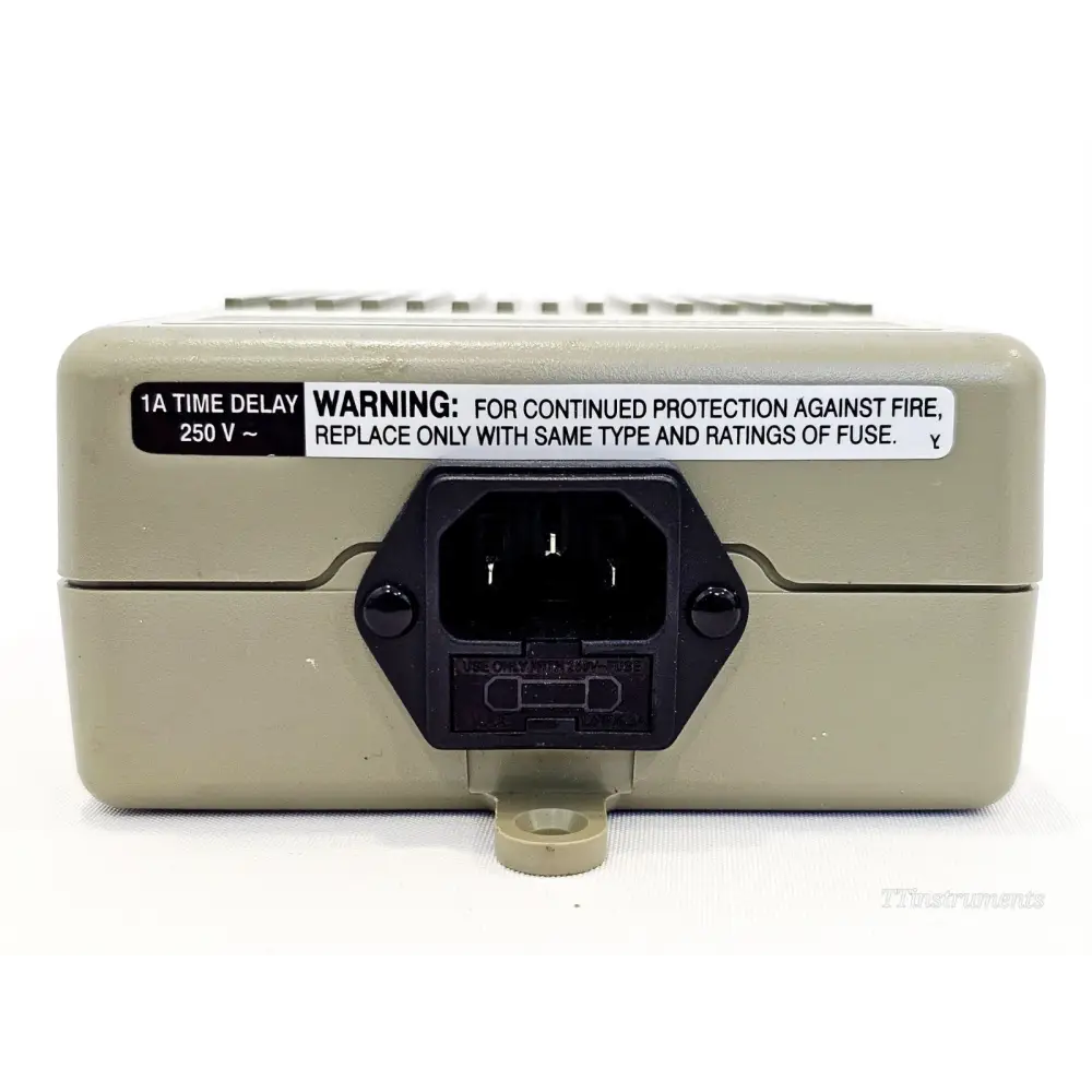 Agilent 87421A Power Supply top view showing IEC C14 mains inlet, fuse holder and fire warning label