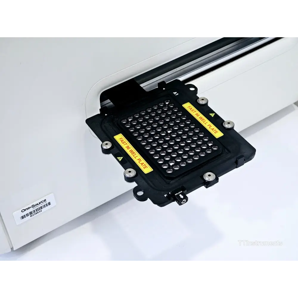 QuantStudio 12K Flex with drawer ejected showing installed Fast 96-Well plate block with yellow warning labels