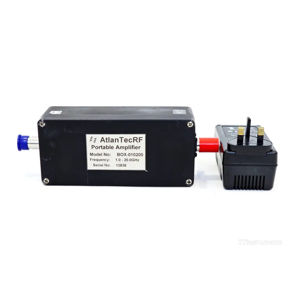 AtlanTecRF BOX-010200 portable amplifier S/N 13836 side view with UK mains battery charger attached