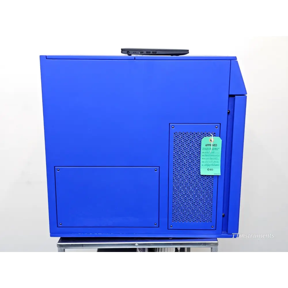 BD FACSCelesta left side panel showing ventilation grille and BD Approved green inspection tag