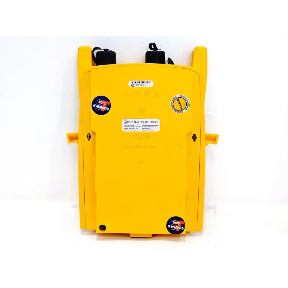 Fluke OptiFiber Pro QUAD OTDR with SC/LC singlemode launch cables displayed alongside unit