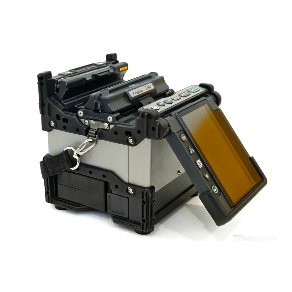 Fujikura FSM-70R ribbon splicer right-side profile showing wind protector and electrode housing