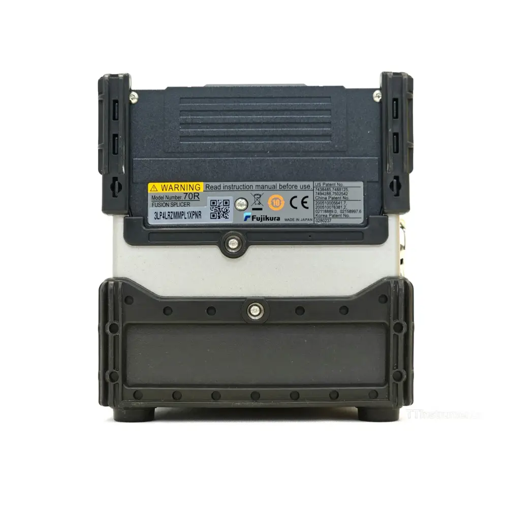 Fujikura FSM-70R splicer top-down view of open V-groove and fibre clamping area