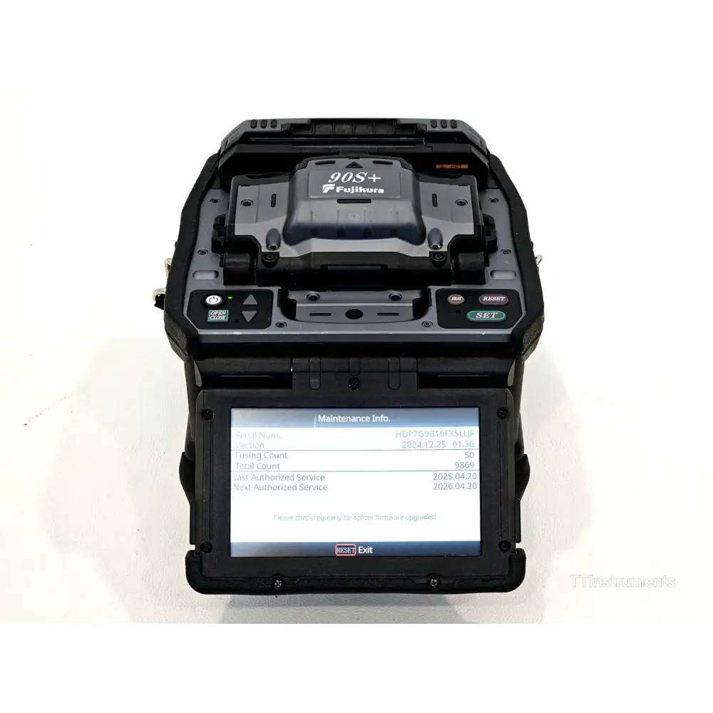 Fujikura 90S+ fusion splicer open lid view showing V-groove fibre alignment stage and electrode assembly