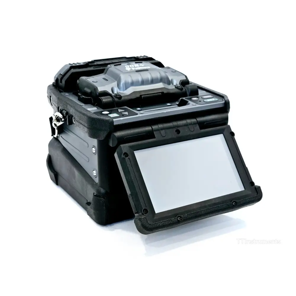 Fujikura 90S+ fusion splicer with wind protector open revealing V-groove fibre alignment stage and electrodes