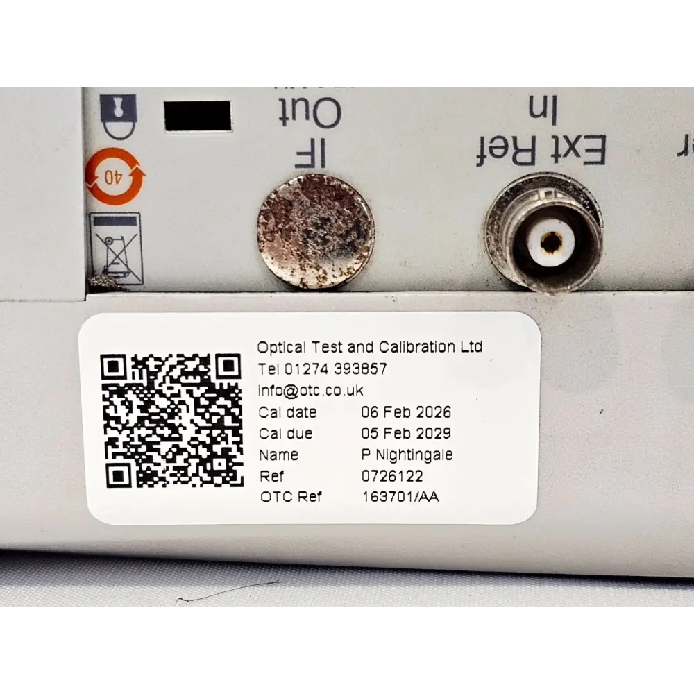 Anritsu MS2724B top panel showing OTC calibration sticker, IF Out and Ext Ref In connectors