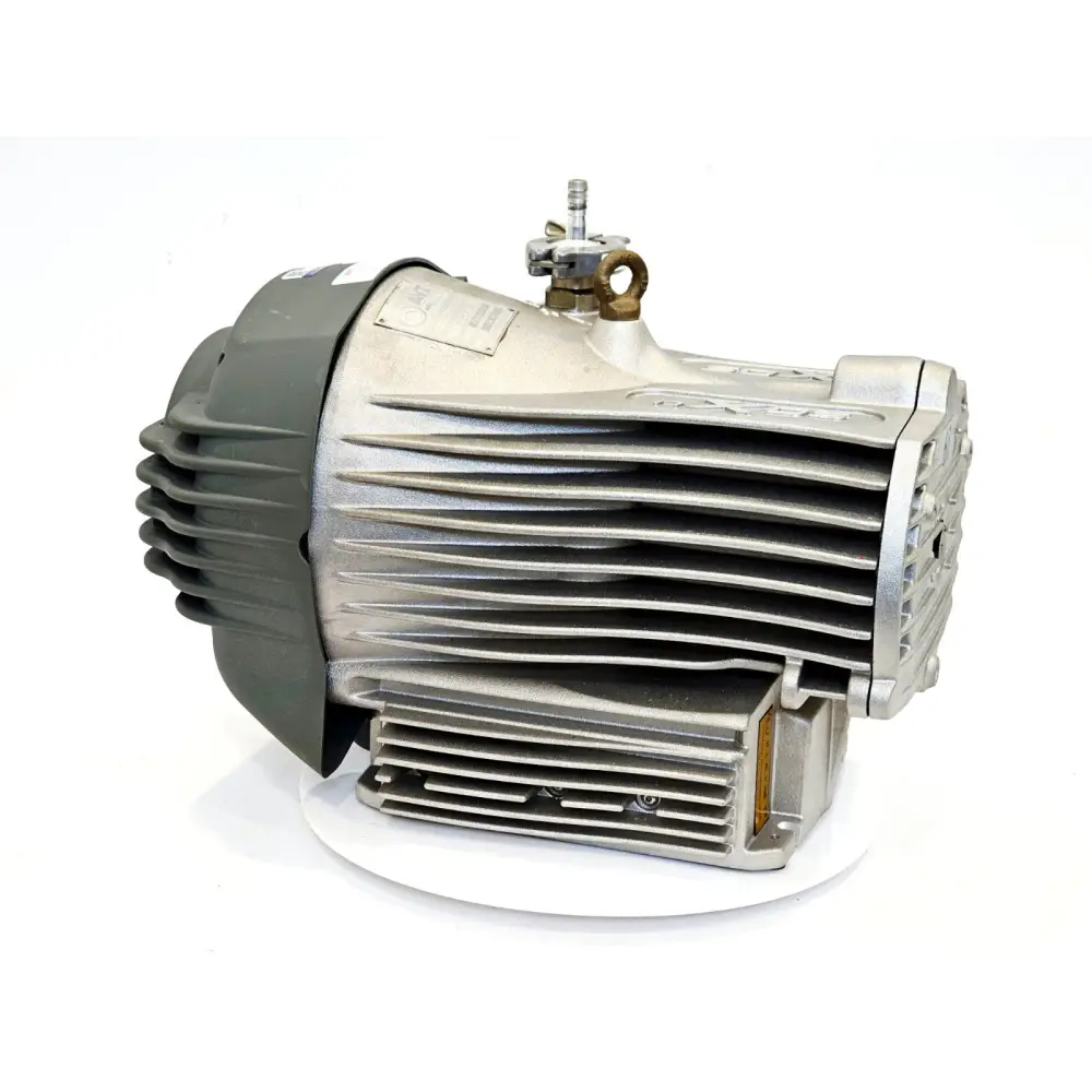 Edwards nXDS6i scroll vacuum pump A735-01-983 — right-rear 3/4 view showing grey motor housing, ribbed cooling fins, gas ballast inlet and exhaust port fitting
