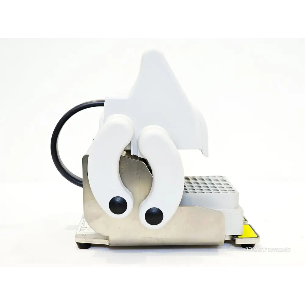 Eppendorf 5391 HeatSealer S100 right side view showing hinged sealing mechanism, carry handle, and 96-well plate adapter