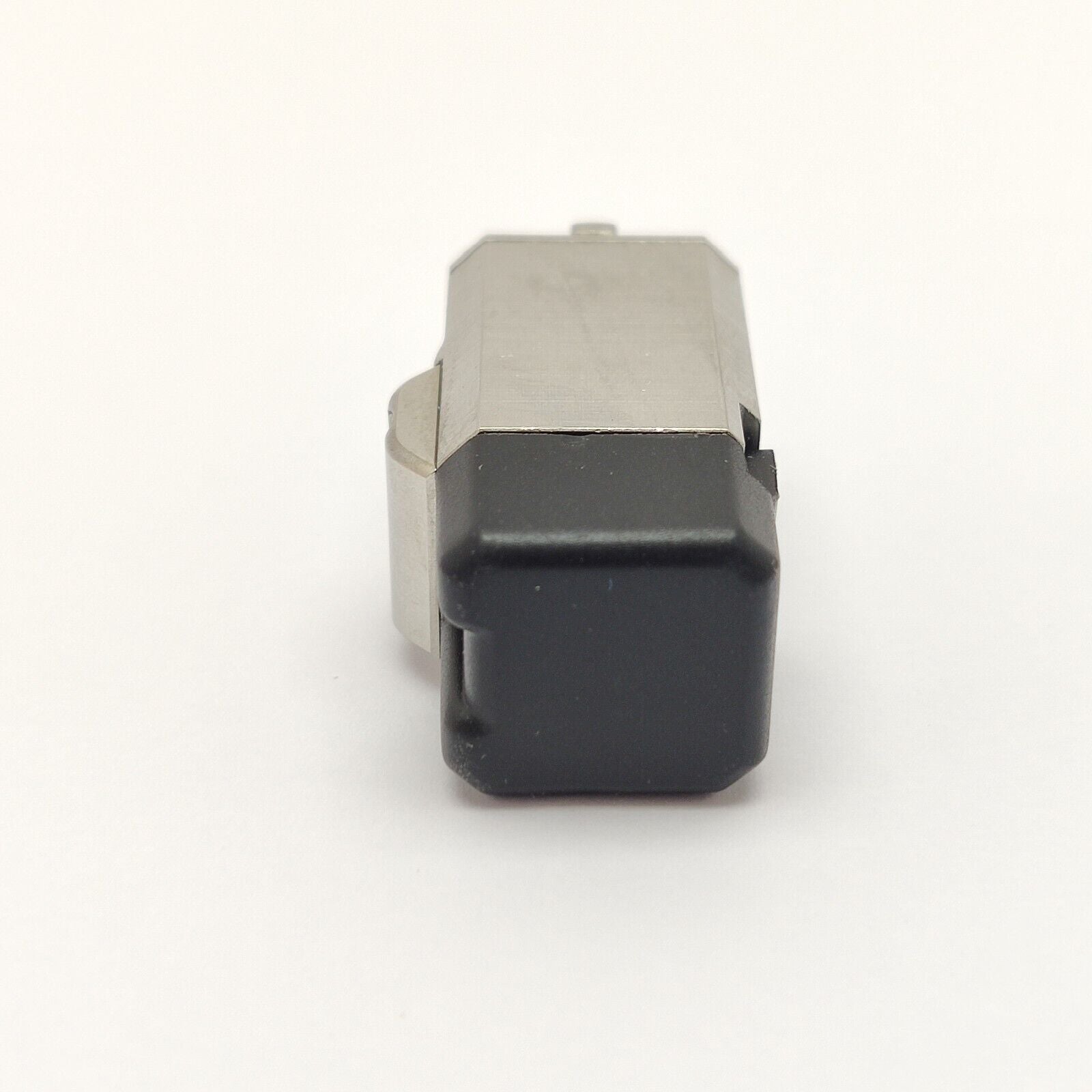 EXFO E-2000 fibre optic adapter connector with dust cap fitted, angled three-quarter view