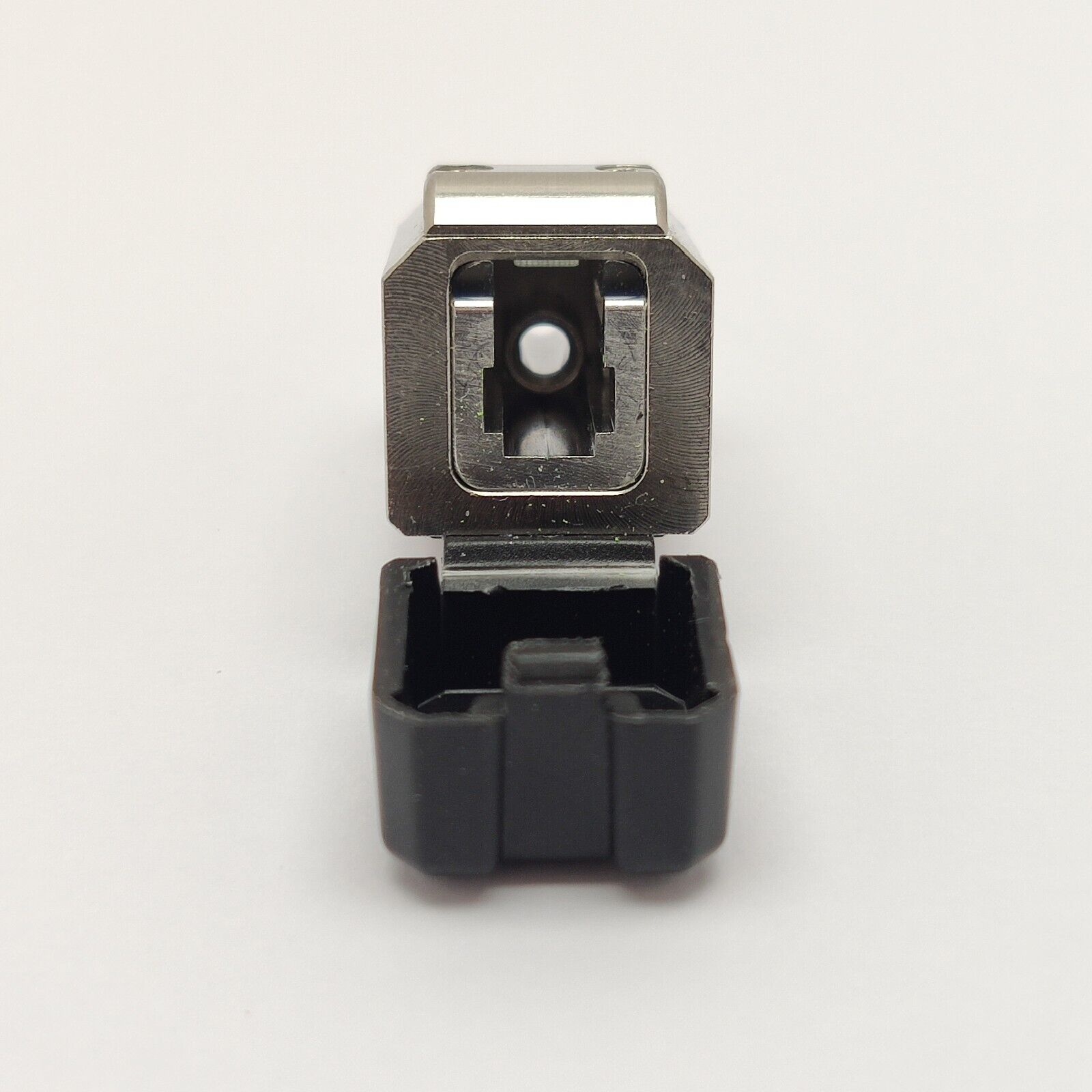 EXFO E-2000 OTDR adapter connector alongside compatible EXFO OTDR instrument port for scale reference