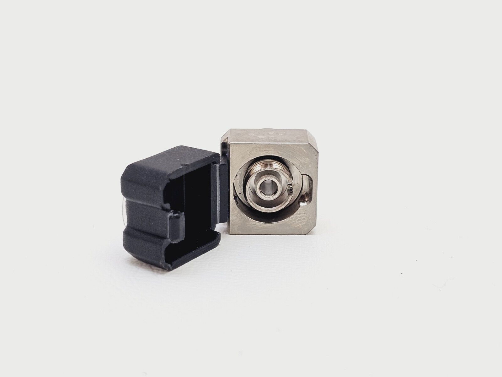 EXFO EUI-89 FC OTDR adapter cap with protective dust cap fitted, angled view