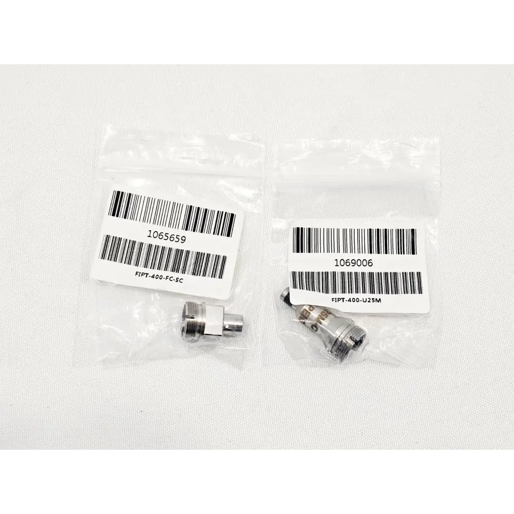 EXFO FIP-400B universal 2.5mm UPC patchcord tip and FC SC bulkhead adapter tip close-up detail