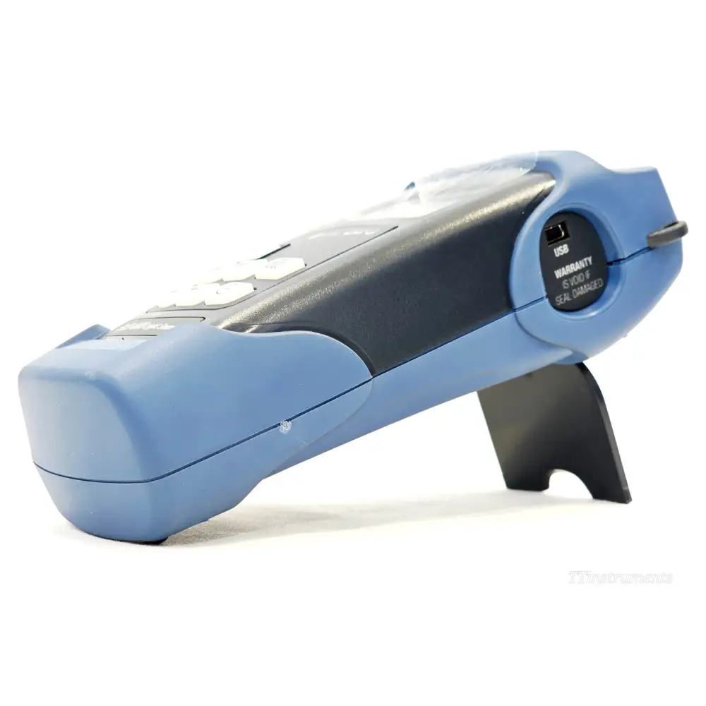 EXFO FLS-600 right-side view showing USB port with warranty seal sticker and instrument stand
