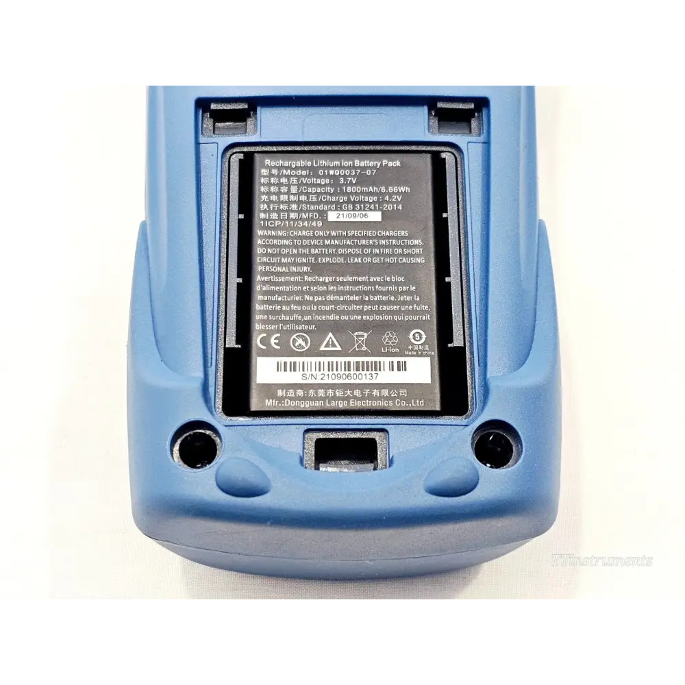 EXFO FLS-600 battery compartment open showing 3.7V 1800mAh lithium-ion battery pack installed