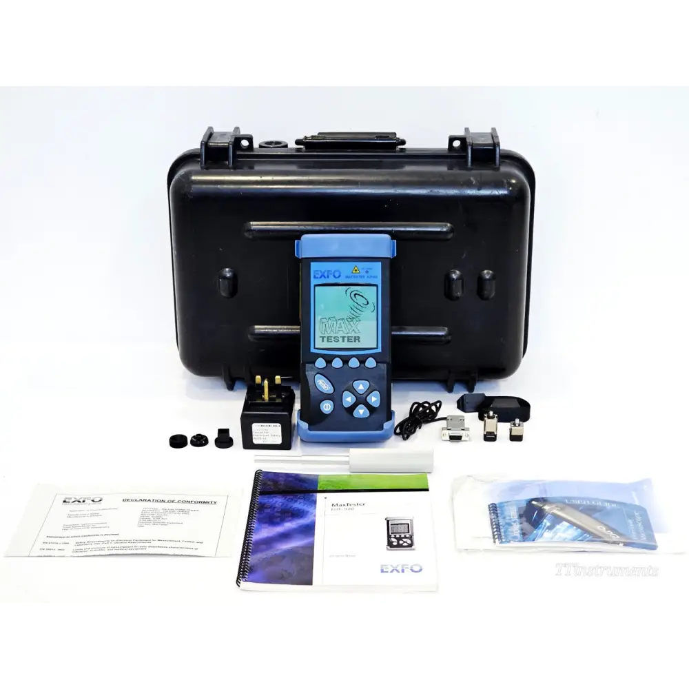 EXFO FOT-922 MaxTester full kit laid out showing unit, case, AC adapter, cables, manuals and Declaration of Conformity