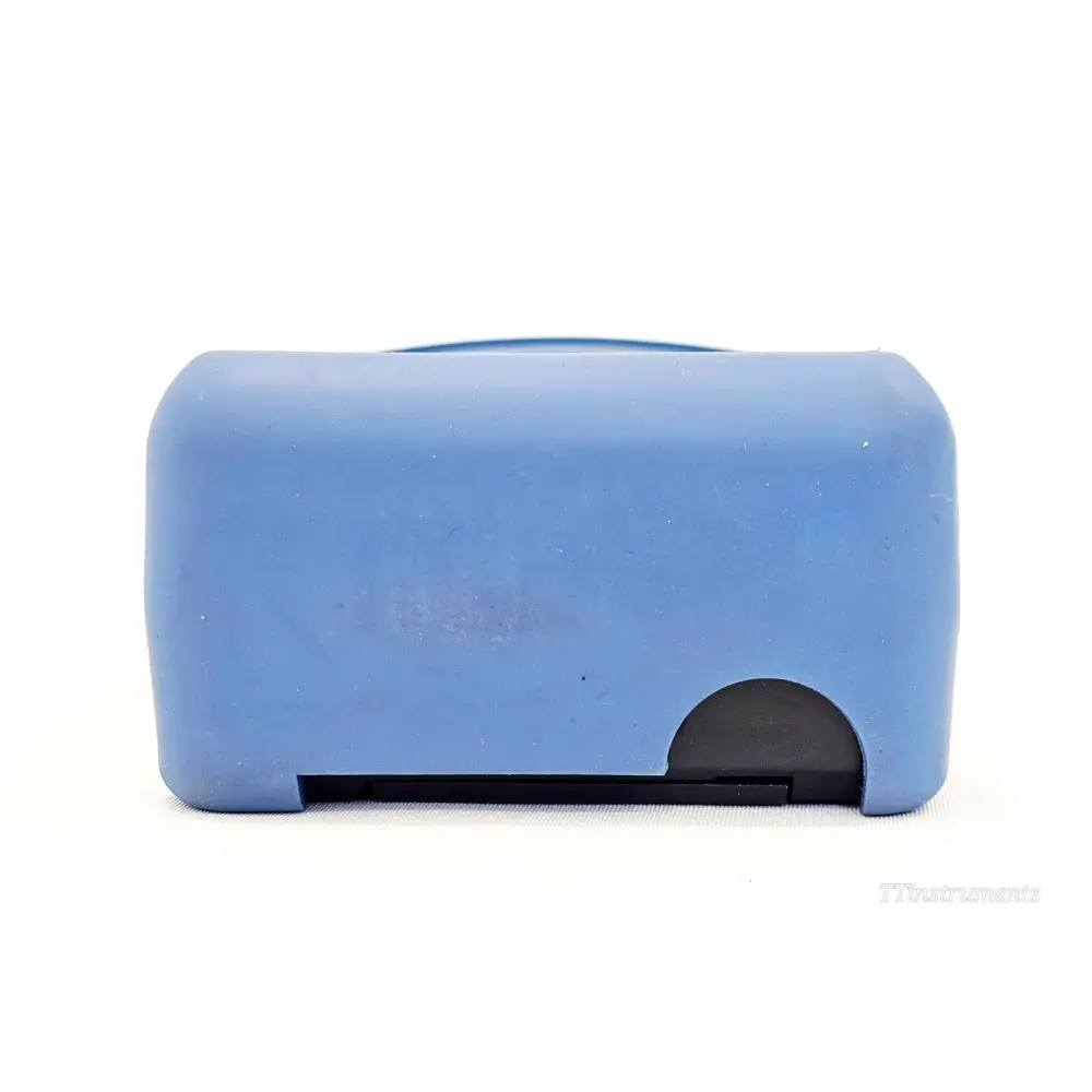 EXFO FOT-922 MaxTester bottom view showing battery compartment door and blue rubber boot base