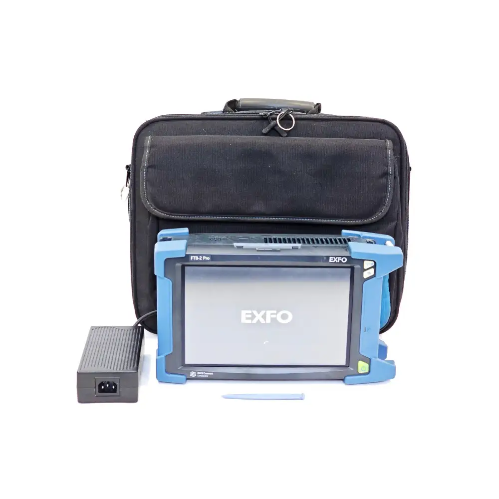 EXFO FTB-2 Pro mainframe shown powered on with EXFO boot screen, AC adapter, stylus, and black soft carry case