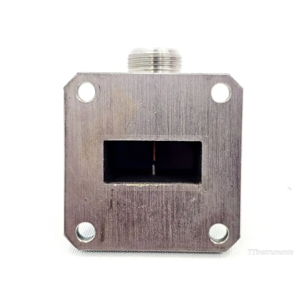 Flann Microwave 16093-NF10 waveguide flange face showing WR90 rectangular aperture with coupling probe and four fixing holes