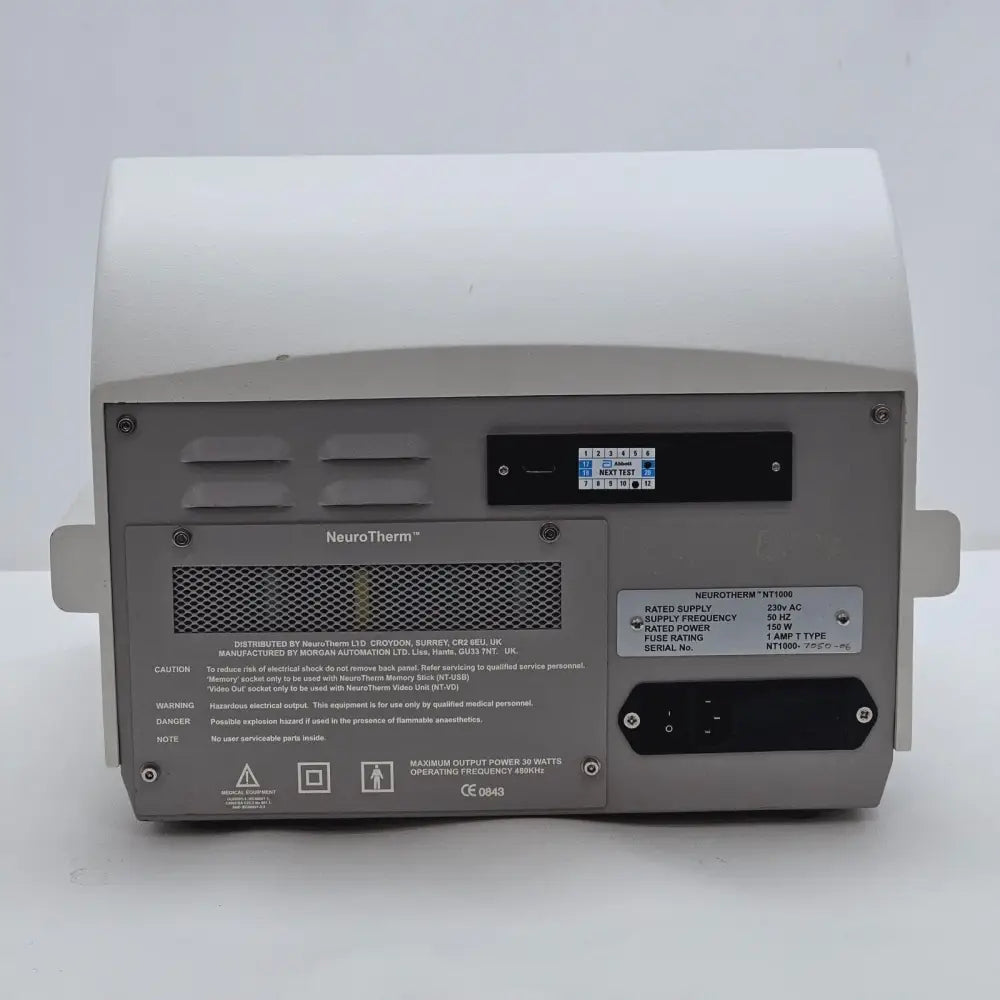 NeuroTherm NT1100 internal view showing prior repair or opened enclosure