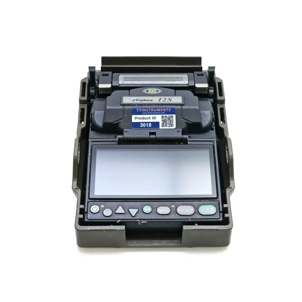 Fujikura 12S splicer top view with wind protector open and splicing chamber visible