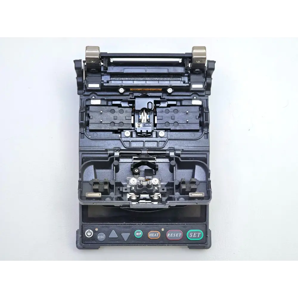 Fujikura CT-06 fibre cleaver close-up showing precision cleaving blade and fibre channel