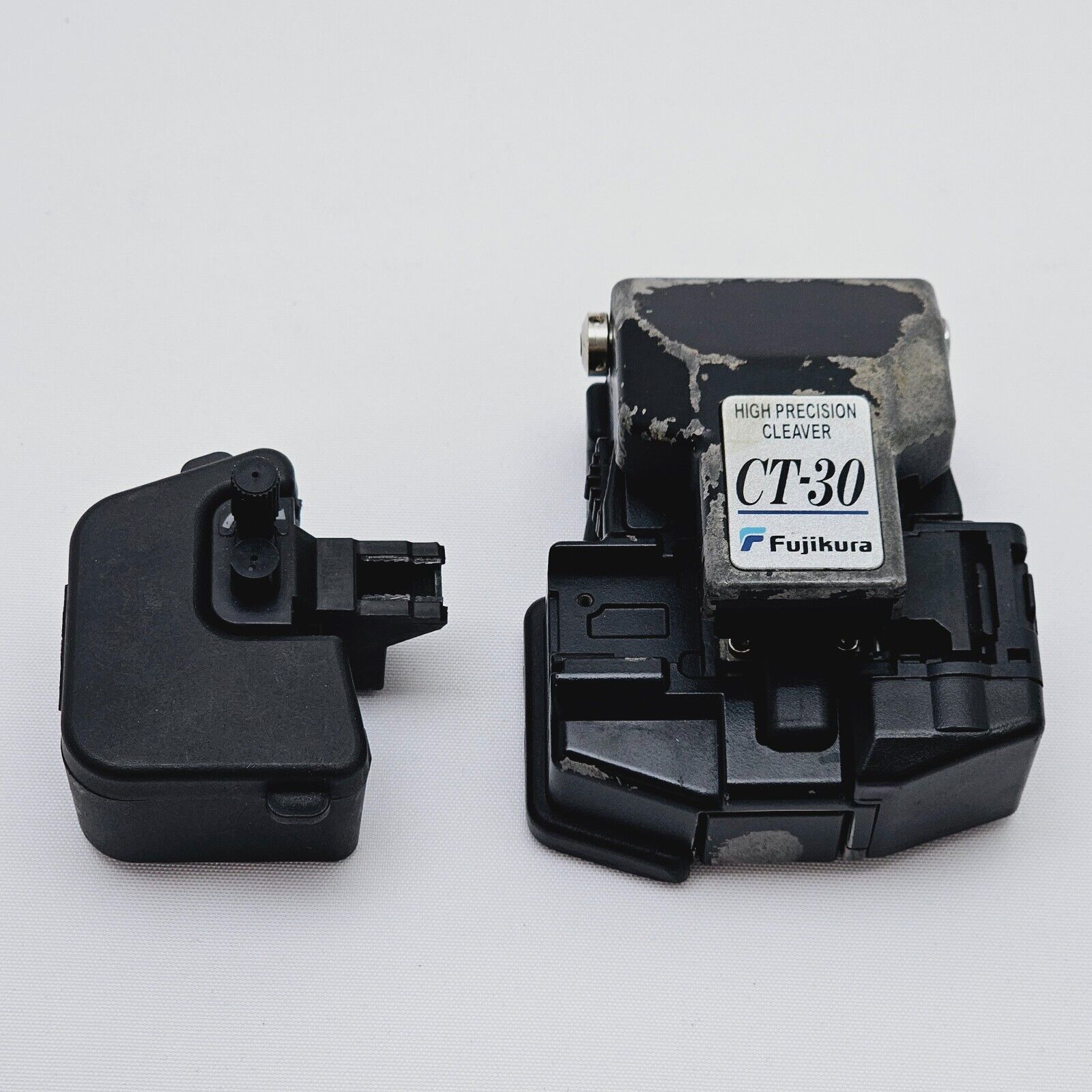 Fujikura FSM-22S splicer side profile view showing compact ruggedised housing