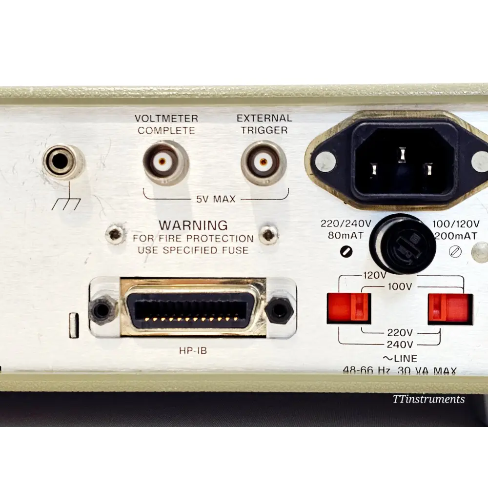 HP 3457A DMM top-down view showing full front panel layout and display