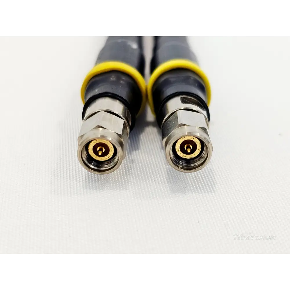 Junkosha Junflon J12J103220-00-1 K connector male ends close-up showing gold centre pins and yellow strain relief