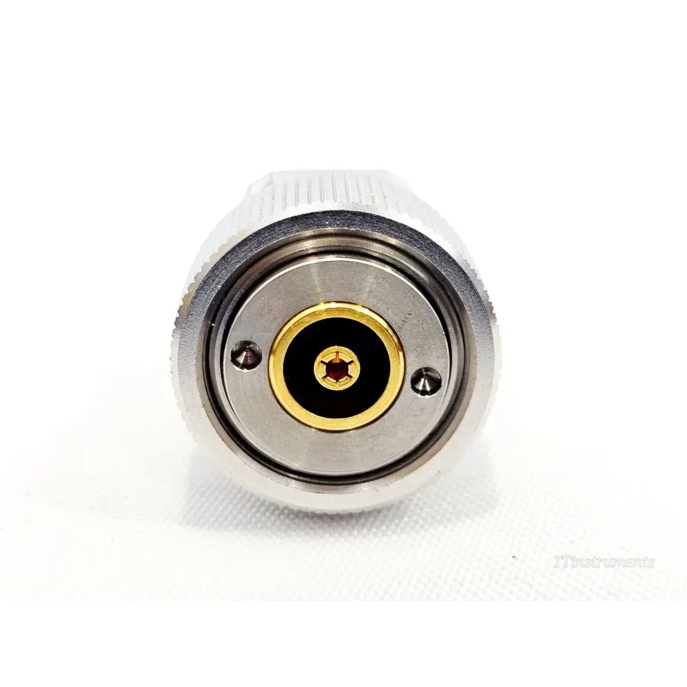 Keysight Agilent 1250-1746 APC-7 adapter front face view showing gold centre pin contact and two alignment holes